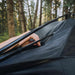 roam-drifter-tent-open-close-up-view-with-person-fixing-tent-poles-in-nature