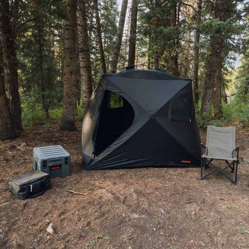 roam-drifter-tent-open-front-corner-view-with-camping-chair-and-roam-case-in-nature