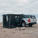 roam-standard-awning-room-black-front-corner-view-on-vehicle-in-nature