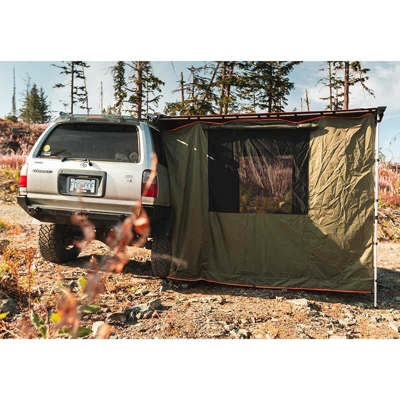 roam-standard-awning-room-forest-green-hyper-orange-rear-view-on-vehicle-in-nature