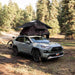 roam-vagabond-lite-rooftop-tent-black-open-side-view-on-toyota-rav4-in-nature