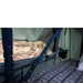 roam-vagabond-lite-rooftop-tent-open-interior-view-with-mesh-window-in-nature