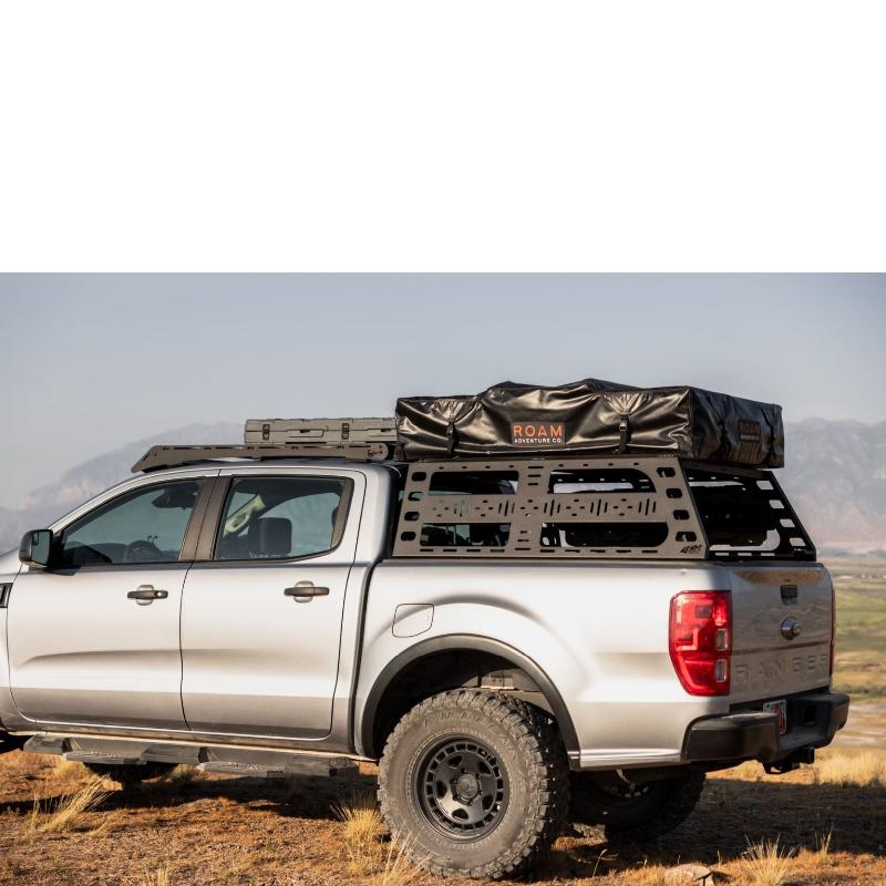 roam-vagabond-rooftop-tent-closed-front-view-on-ford-ranger-in-nature