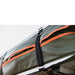 roam-vagabond-rooftop-tent-forest-green-hyper-orange-closed-close-up-view-with-velcro-straps-in-nature