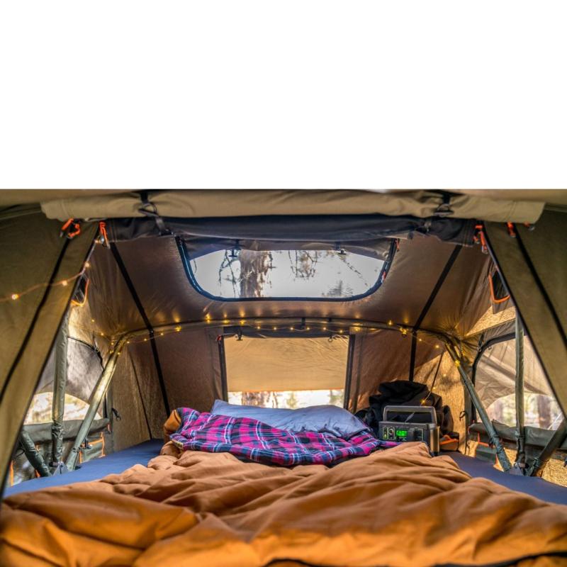 roam-vagabond-rooftop-tent-forest-green-hyper-orange-open-interior-view-with-pillows-in-nature