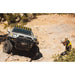 sherpa-kc-gravity-pro6-light-bar-mounts-on-vehicle-with-person-in-terrain