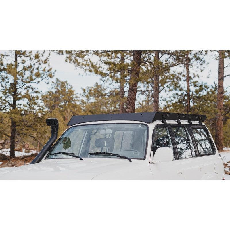 sherpa-la-sal-roof-rack-for-1990-1997-land-cruiser-80-series-front-corner-view-with-fairing-in-foresst