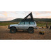 sherpa-la-sal-roof-rack-for-1990-1997-land-cruiser-80-series-side-view-on-vehicle-with-person-in-nature