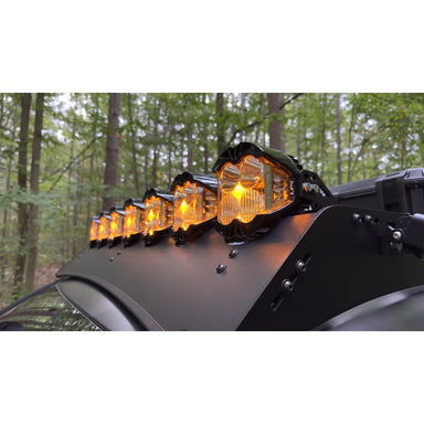 sherpa-lp4-mounts-side-view-on-vehicle-with-lights-in-nature