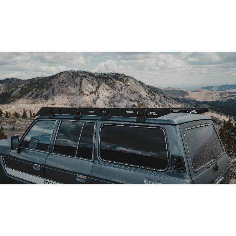 sherpa-mineral-roof-rack-for-1980-1990-land-cruiser-60-series-rear-corner-view-in-terrain