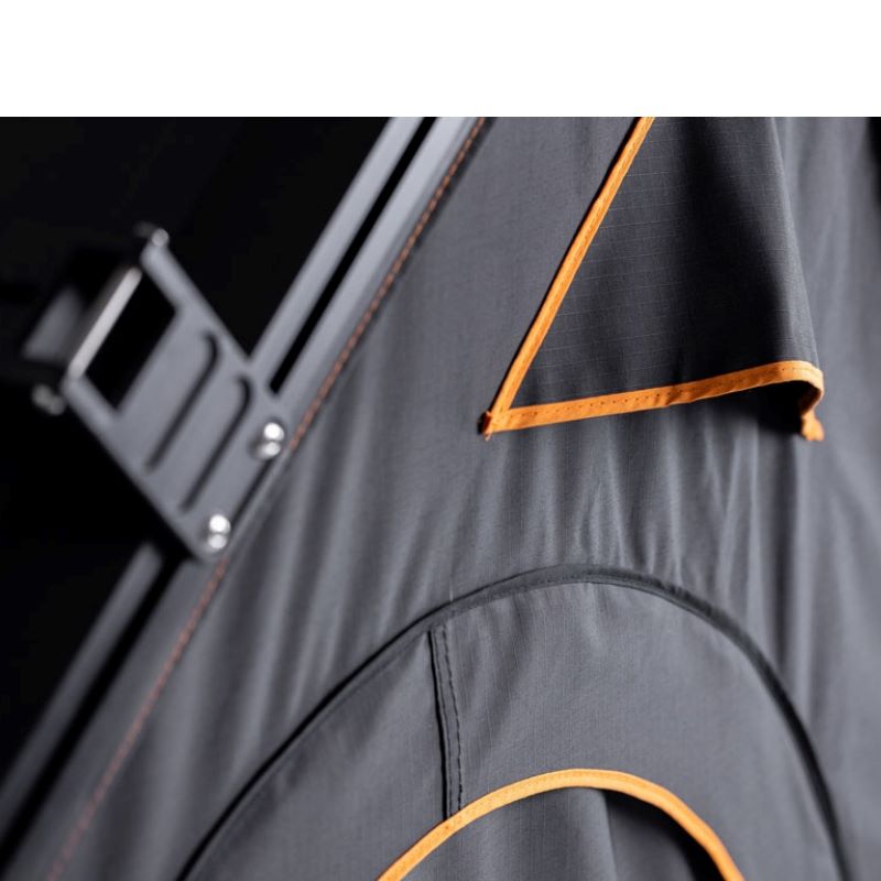 tentbox-cargo-hard-shell-roof-top-tent-black-open-close-up-view-with-rip-stop-fabric