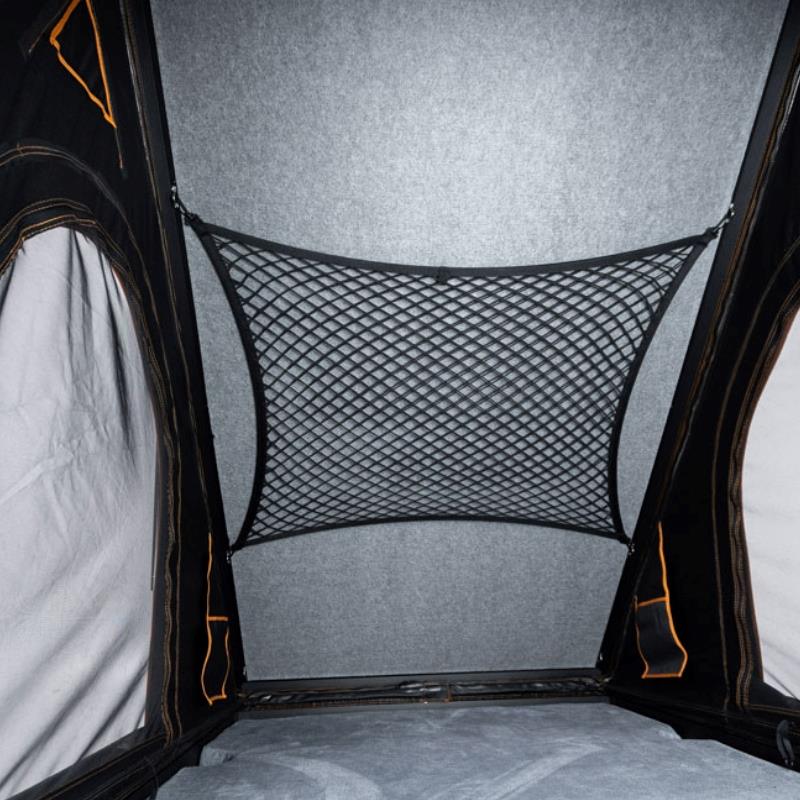 tentbox-cargo-hard-shell-roof-top-tent-black-open-interior-view-with-storage-net