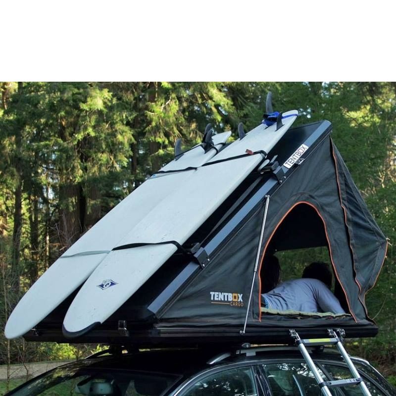 tentbox-cargo-hard-shell-roof-top-tent-black-open-rear-corner-view-on-vehicle-with-surf-boards-on-accesory-rails-in-nature