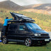 tentbox-cargo-hard-shell-roof-top-tent-black-open-side-view-on-volkswagen-caravelle-in-nature
