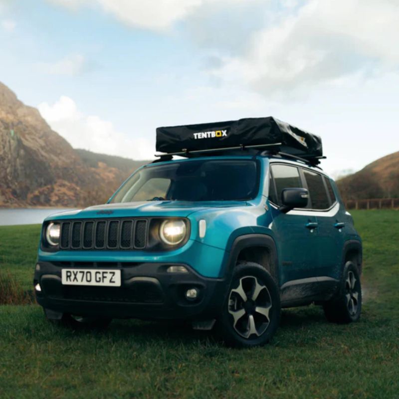 tentbox-lite-1-0-soft-shell-roof-top-tent-closed-front-corner-view-on-jeep-in-nature