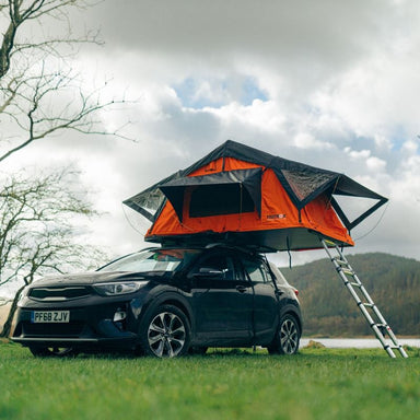 tentbox-lite-1-0-soft-shell-roof-top-tent-orange-open-front-corner-view-on-kia-xceed-in-nature