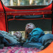 tentbox-lite-1-0-soft-shell-roof-top-tent-orange-open-interior-view-with-two-persons-inside