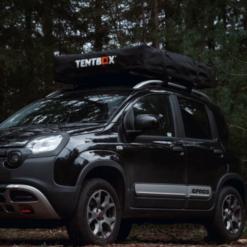 tentbox-lite-2-0-soft-shell-roof-top-tent-closed-front-corner-view-on-fiat-panda-cross-in-forest