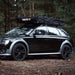 tentbox-lite-XL-soft-shell-roof-top-tent-closed-front-corner-view-on-audi-a4-in-forest