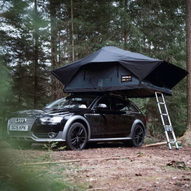 tentbox-lite-XL-soft-shell-roof-top-tent-slate-gray-open-with-ladder-front-corner-view-on-audi-a4-in-forest