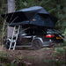 tentbox-lite-XL-soft-shell-roof-top-tent-slate-gray-open-with-ladder-rear-corner-view-on-audi-a4-in-forest