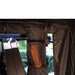 tentbox-side-awning-room-open-interior-view-with-storage-pocket-and-thermos-flask-in-nature