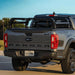 tuwa-pro-shiprock-mid-height-rack-for-t-slot-rails-side-view-on-ford-ranger-on-road-with-nature-background