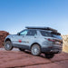badass-tents-rugged-clamshell-roof-top-tent-closed-rear-corner-profile-view-on-land-rover-discovery-5