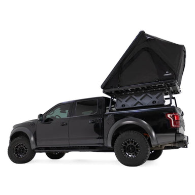 reespirit-recreation-aspen-lite-hard-shell-roof-top-tent-black-open-side-view-on-ford-f150-on-white-background