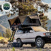 overland-vehicle-systems-bushveld-hard-shell-roof-top-tent-open-on-toyota-land-cruiser-with-family-inside