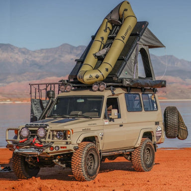 overland-vehicle-systems-mamba-hard-shell-roof-top-tent-open-on-toyota-land-cruiser-troopy-in-nature